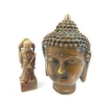 South East Asian filled and bronzed head of Buddha, 16cm h., and a soapstone figurine of immortal.