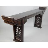 Chinese altar table ('qiaotou'an'), late Qing dynasty, everted top, pair spiritual icons,