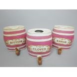 Three ceramic kegs for cloves, shrub and bitters, 32cm h.