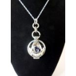 Masonic style silver hinged pendant holding a faux hard stone ball on fine chain.