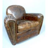 Contemporary brown leather club chair with buttoned arm on ball feet
