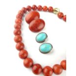 Strand of uniform coral beads, a pair of matching ear clips and a pair of silver mounted turquoise