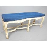 Louis XVI design carved, cream painted window seat with blue upholstered seat on acanthus underframe