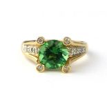 14ct yellow gold, green tourmaline ring with diamond shoulders.