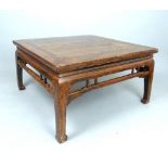 Chinese low table, the cleated square top above a gallery and C-shaped square legs, 99cm w