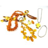 Collection of vintage amber jewellery comprising a yellow metal mounted crucifix pendant, two