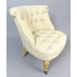 Contemporary button back bedroom chair, turned and limed feet.