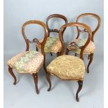 Set of four Victorian walnut balloon back chairs, the overstuffed seats above cabriole legs, (4)