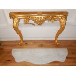 Louis XV design giltwood serpentine front console table with white marble top over a pierced