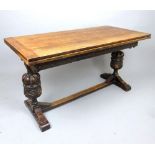 17th century style carved oak draw-leaf table, the cleated plank top above a guilloche frieze, cup