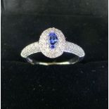 18 ct white gold sapphire and diamond cluster ring, total weight 1 ct