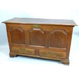 George III oak mule chest, the arched triple panelled front over two drawers on ogee bracket feet,
