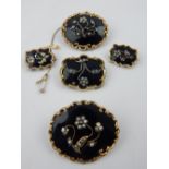 Five memoriam brooches, floral and seed pearl decoration, one with 1847 inscription.