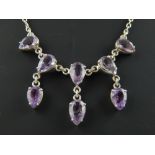 Silver and amethyst necklace set with eight faceted pear shape stones