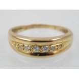 Ladies dress ring, 7 graduated diamonds, 9ct gold setting.