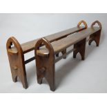 Pair of Pugin style oak bench seats with pierced arch end standards and central stretcher, 167 cm L