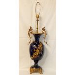 French decorated vase converted to table lamp, gilt brass cherub finials, sprig of flowers to body