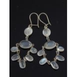 Pair of silver moonstone cluster drop earrings.