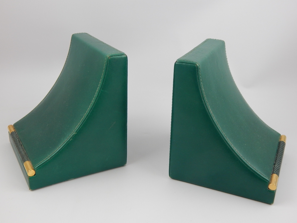 Pair of Asprey green leather book ends, 13.5cm h.