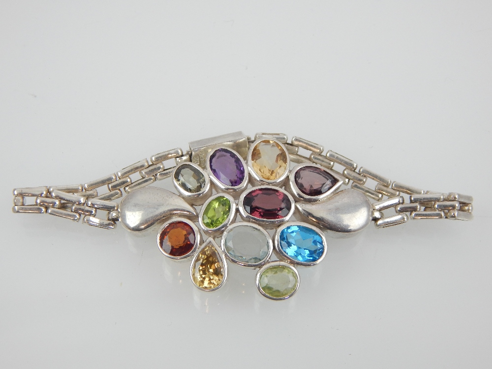 Contemporary silver and multi gemstone bracelet with open geometric links