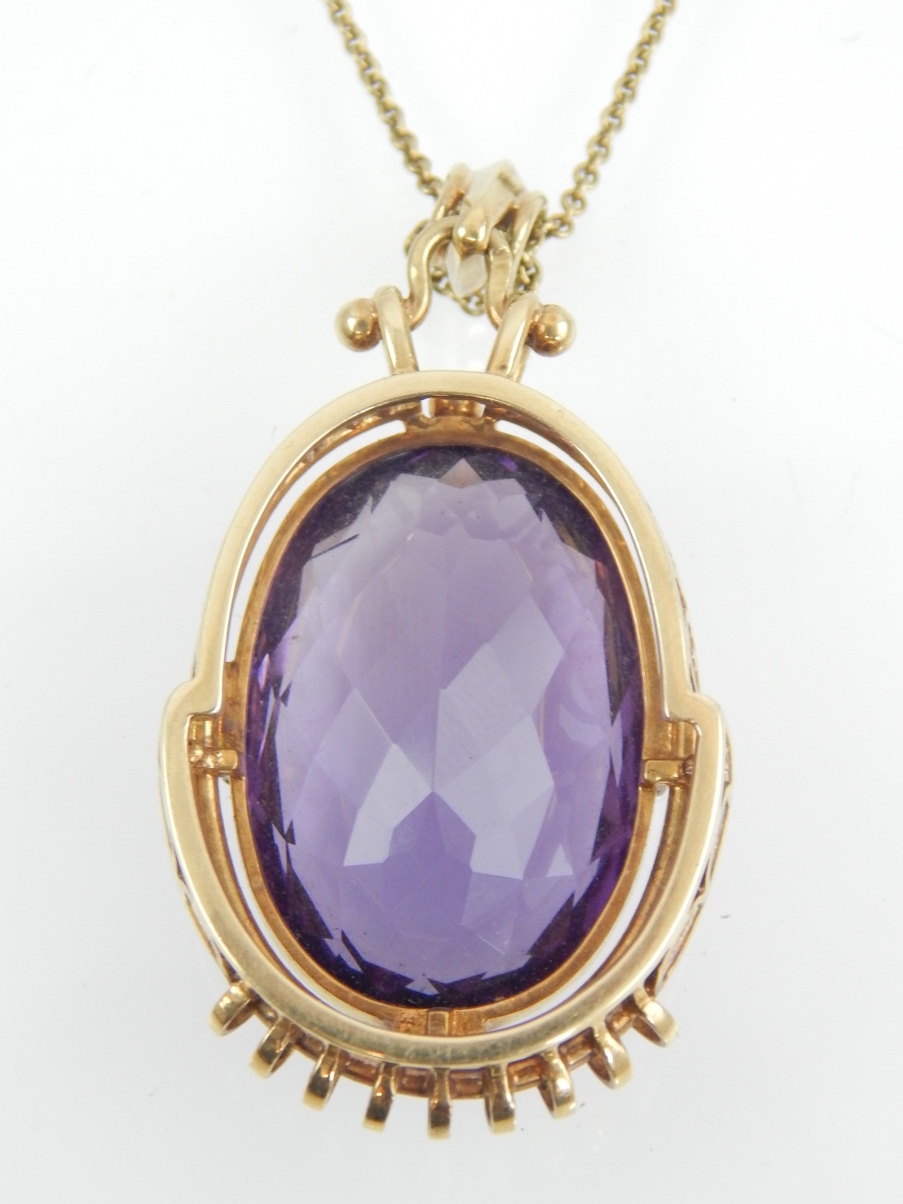 Amethyst pendant, the oval cut stone within a yellow metal frame, on a 14ct gold chain, 17. - Image 2 of 2