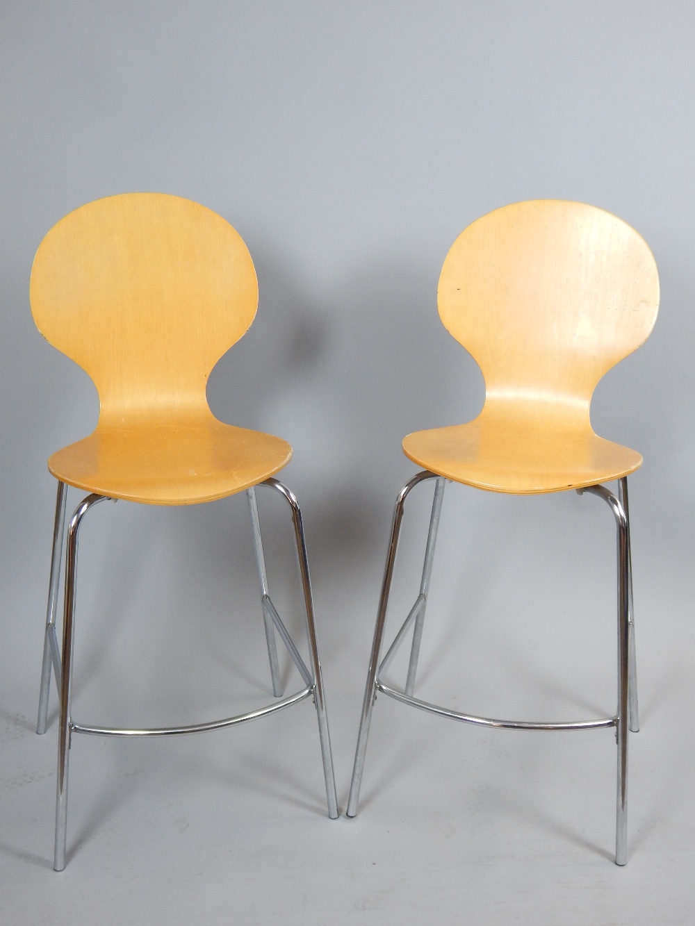 Pair of contemporary stained ply and chrome bar stools.