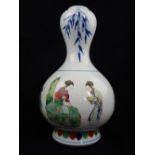 Chinese famille verte tulip vase, decorated with a continuous scene of oriental merchants,