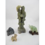 A Chinese jadeite carving of Lohan, a jadeite elephant, buddha and cast temple dog.