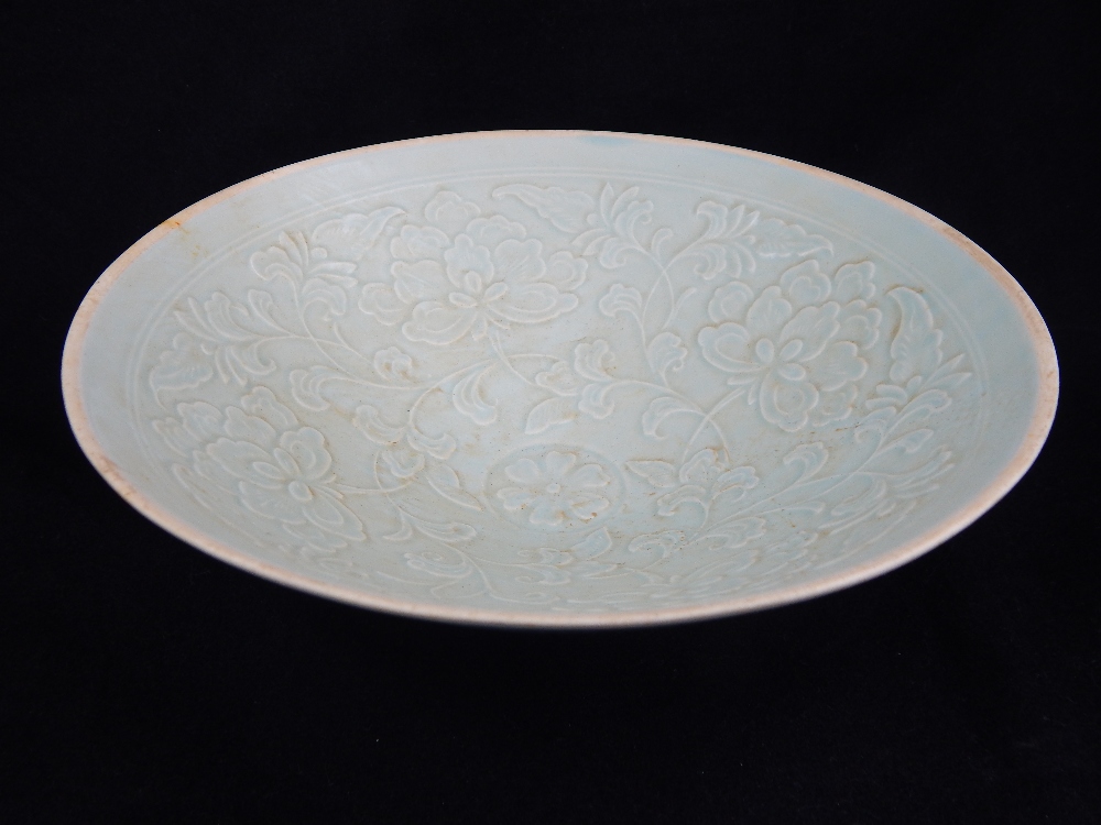 Chinese celadon bowl, raised foliate decoration to interior.