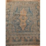 North West Persian part silk rug, traditional floral design over blue ground, fringed (cut down),