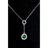 Silver cubic zirconia and green stone drop pendant on chain.