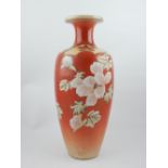 Early 20th century Kutani vase painted with peony on a mottled pale red ground, 30 cm h.