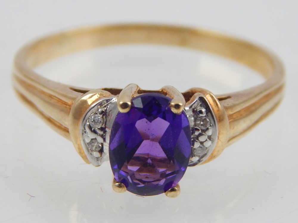 10ct yellow gold amethyst and diamond ring.