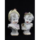 Pair of continental 19th C painted porcelain busts of a boy and a girl with open mouths and
