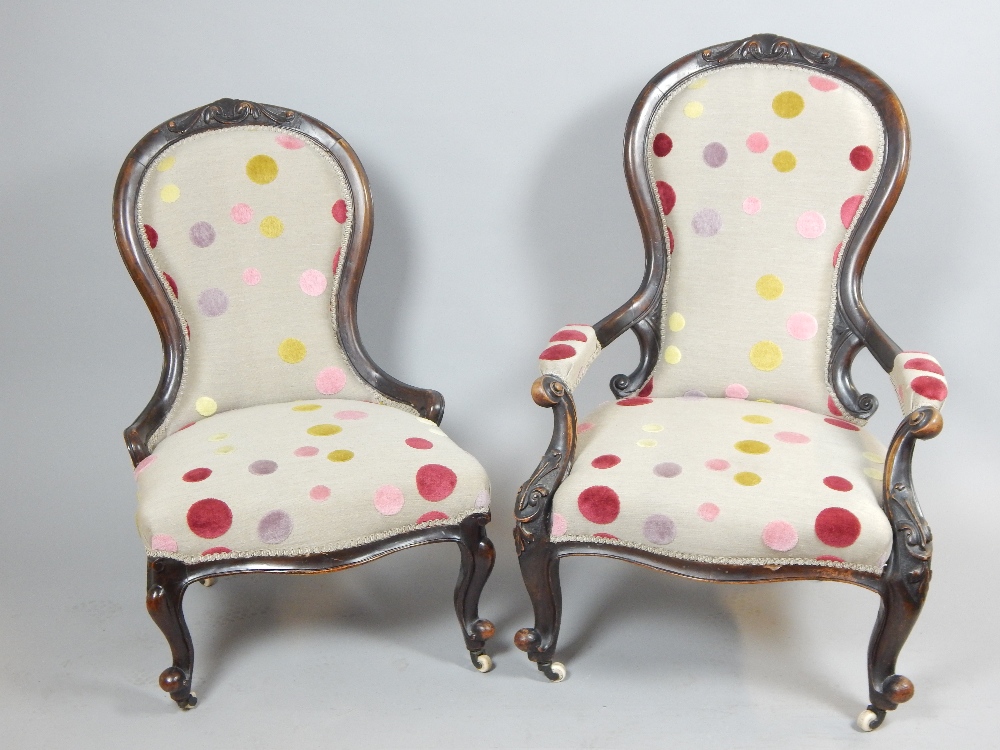 Pair of late Victorian carved walnut spoonback chairs upholstered in contemporary polychrome spot