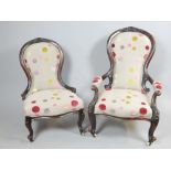 Pair of late Victorian carved walnut spoonback chairs upholstered in contemporary polychrome spot