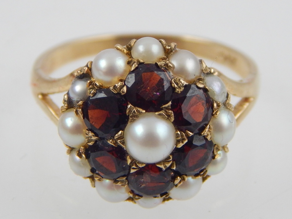9ct yellow gold garnet and pearl flowerhead cluster ring.