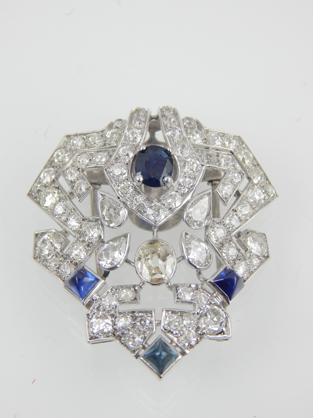 An antique Art Deco sapphire and diamond brooch in white gold circa 1920.
