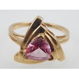 9ct yellow gold pink topaz ring the trillion cut stone in triangular mount.