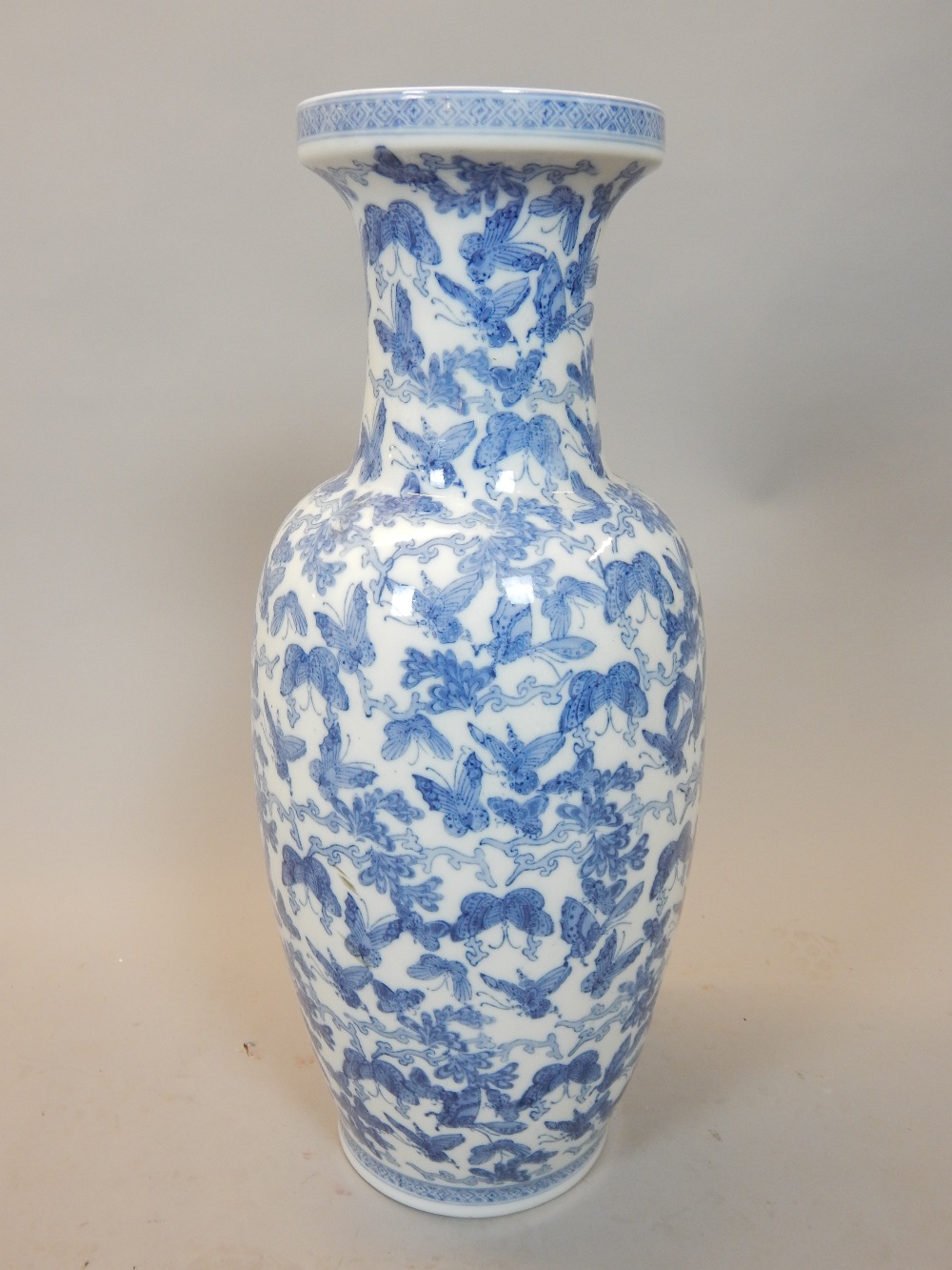 Chinese blue and white vase decorated with butterflies 62cm h