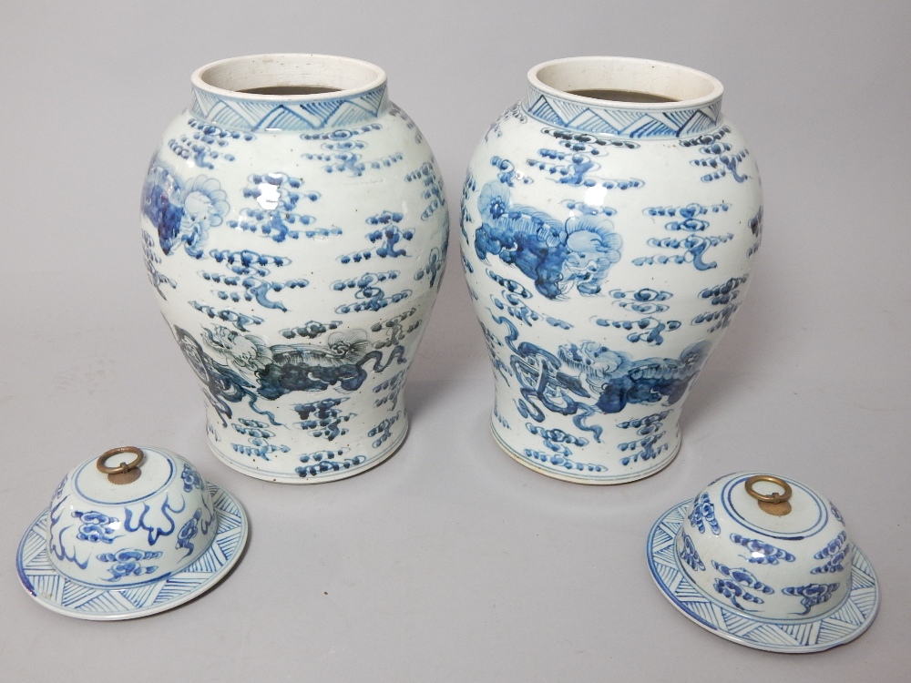 Pair of Chinese blue and white vases with covers, of baluster form and decorated with dragons, - Image 2 of 2