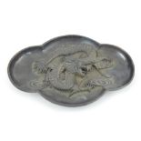 Chinese bronze tray, shaped edge, the centre with raised dragon design, 19cm l.