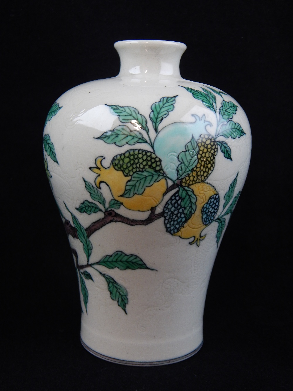 Chinese Sancai style baluster shaped vase, decorated with pomegranate and incised with dragons,