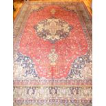 Mahal rug, central floral tear drop medallion over red ground with foliate spandrels, green border,