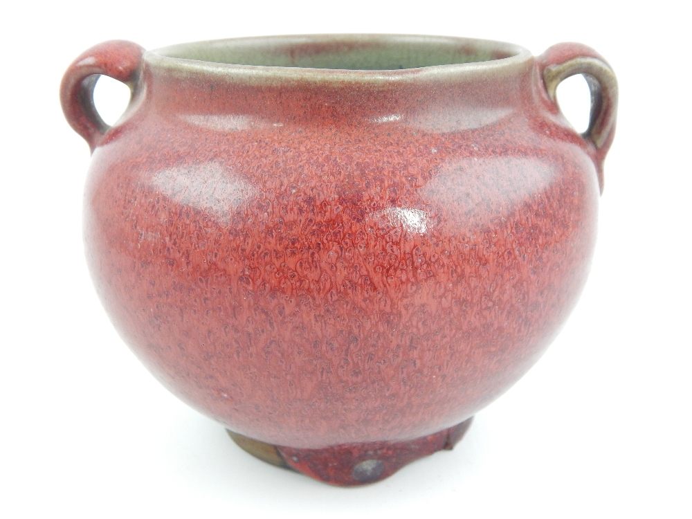 Chinese red glazed twin handled vase, 11cm h.