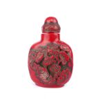 Chinese red snuff bottle carved with koi carp fish, 7.8cm h.