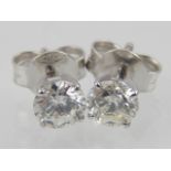 Pair of 18ct white gold diamond ear studs, total weight 1ct.