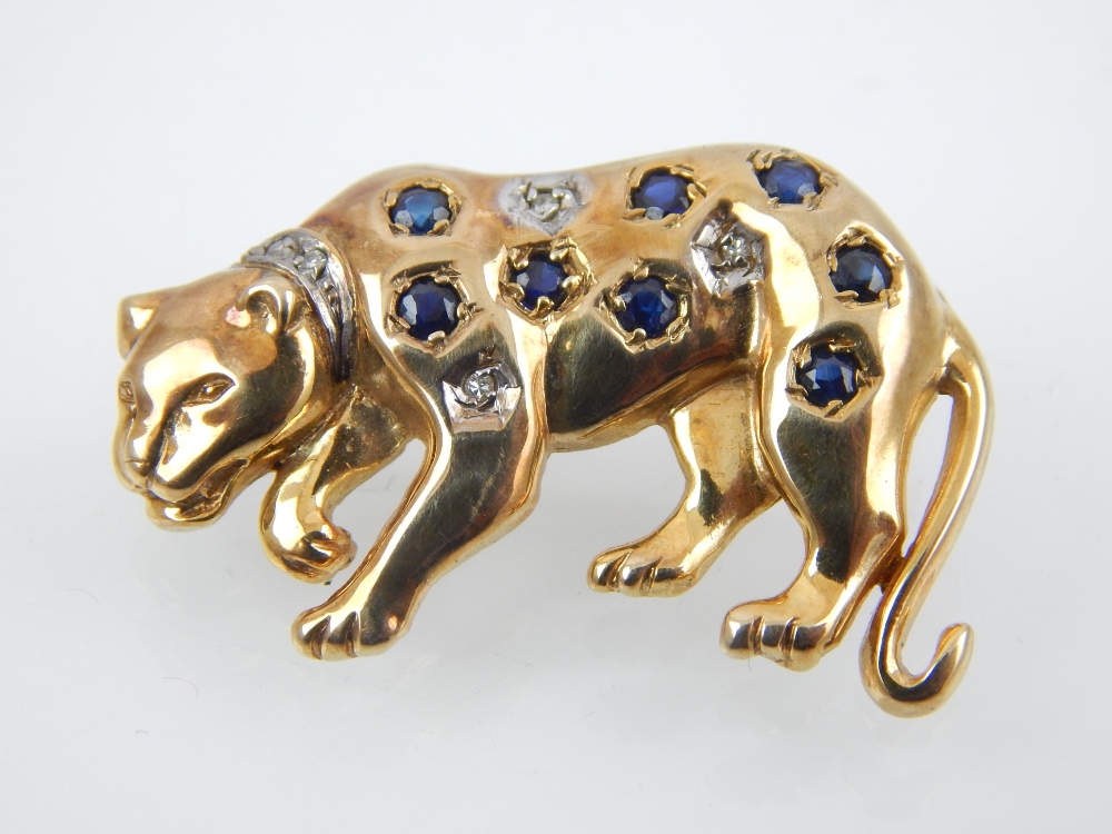 9ct gold brooch modelled in the form of a leopard, set with sapphires and diamonds.