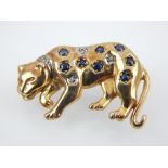 9ct gold brooch modelled in the form of a leopard, set with sapphires and diamonds.
