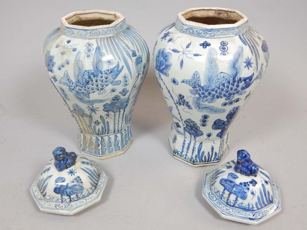 Pair of Chinese octagonal baluster shaped lidded vases, decorated with fish, 57cm h, - Image 2 of 2